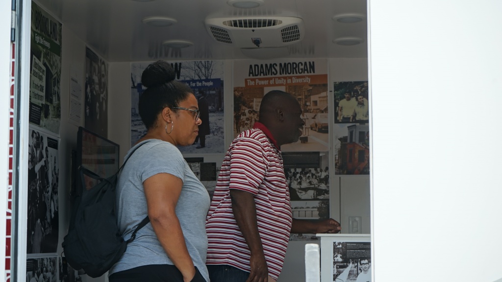 Two visitors look inside the Humanities Truck.